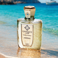 Akdeniz Extrait de Parfum by Unique’e Luxury with perfume bottle by turquoise Mediterranean water
