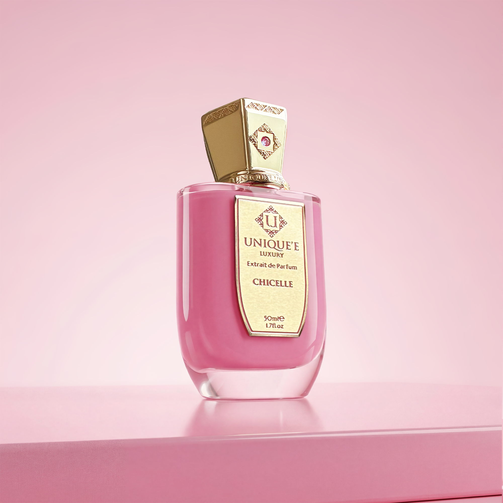 Pink perfume bottle with gold cap on a white background unique luxury chicelle