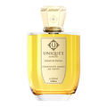 A bottle of 'Chocolate Makes Me Happy' perfume by Unique'e Luxury with a gold-colored cap and a clear amber-colored liquid inside.