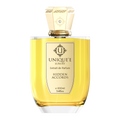 A bottle of 'HIDDEN ACCORDS' perfume by Unique'e Luxury with a gold label and a clear cap, containing 100 ml of extract de Parfum.