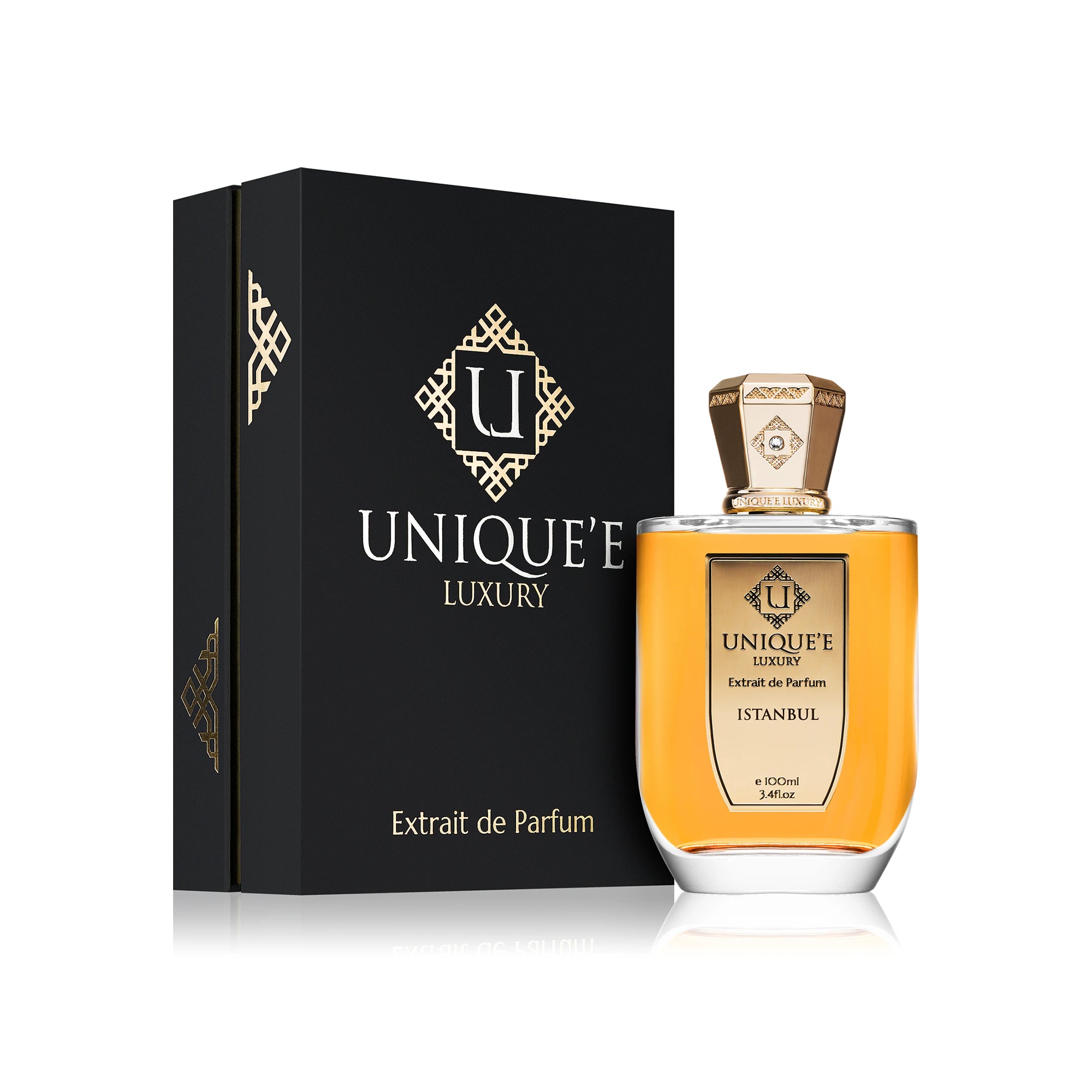 A bottle of Unique'e Luxury Istanbul perfume with a gold-colored cap and a label indicating it is an extract de Parfum.